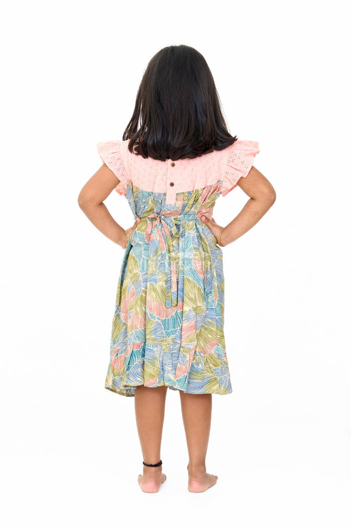 The Nesavu Girls Cotton Frock Trendy Girls Cotton New Dress with Vibrant Leaf Print and Lace Yoke Nesavu Nesavu Girls Cotton New Dress Bold Leaf Print Flutter Sleeves Lace Detailing