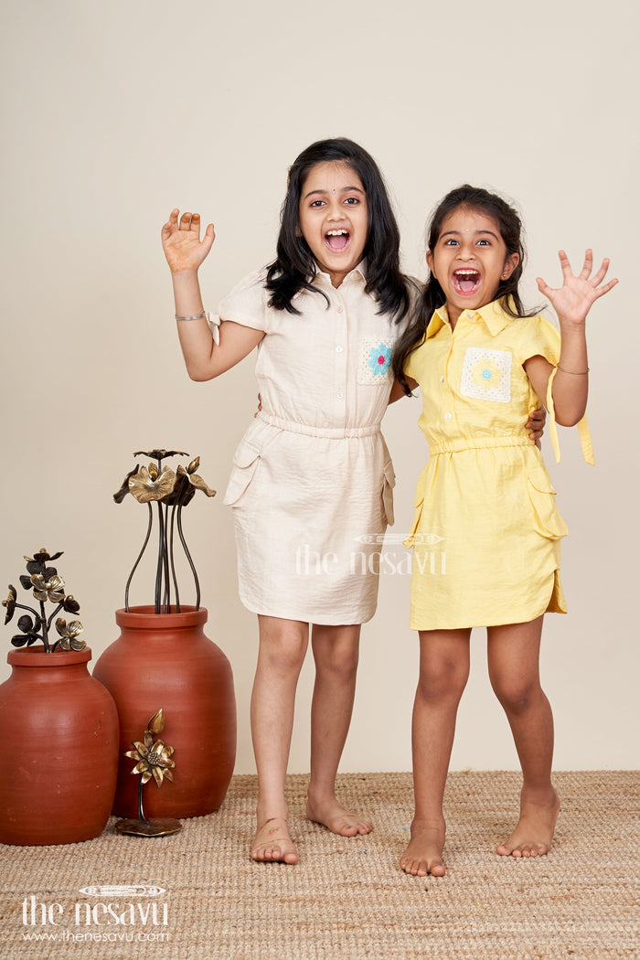 The Nesavu Girls Cotton Frock Yellow collared cotton frock with crochet detail for girls Nesavu Nesavu girls yellow cotton frock with collar and crochet pocket for casual summer wear